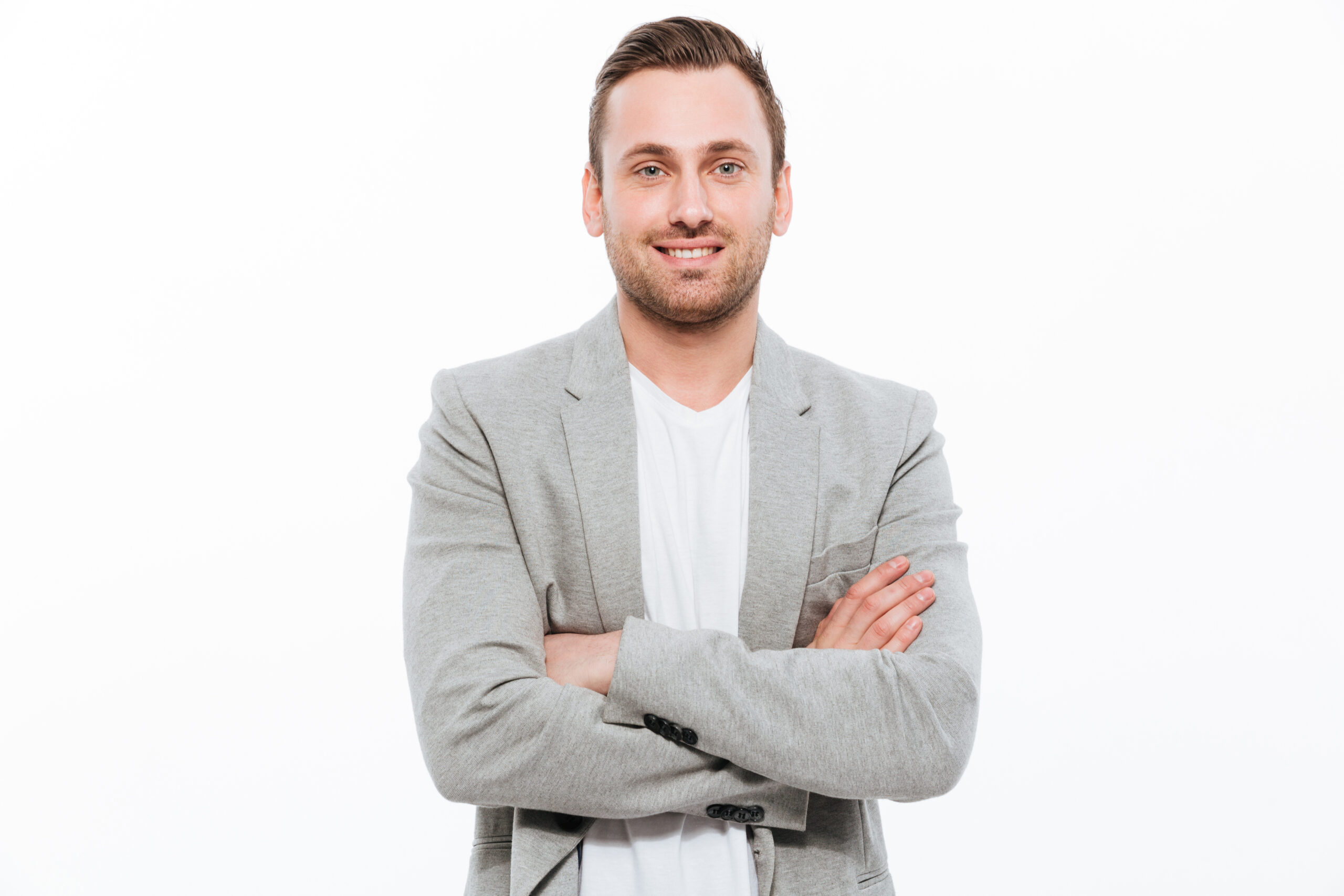 Portrait of successful man having stubble posing on camera with